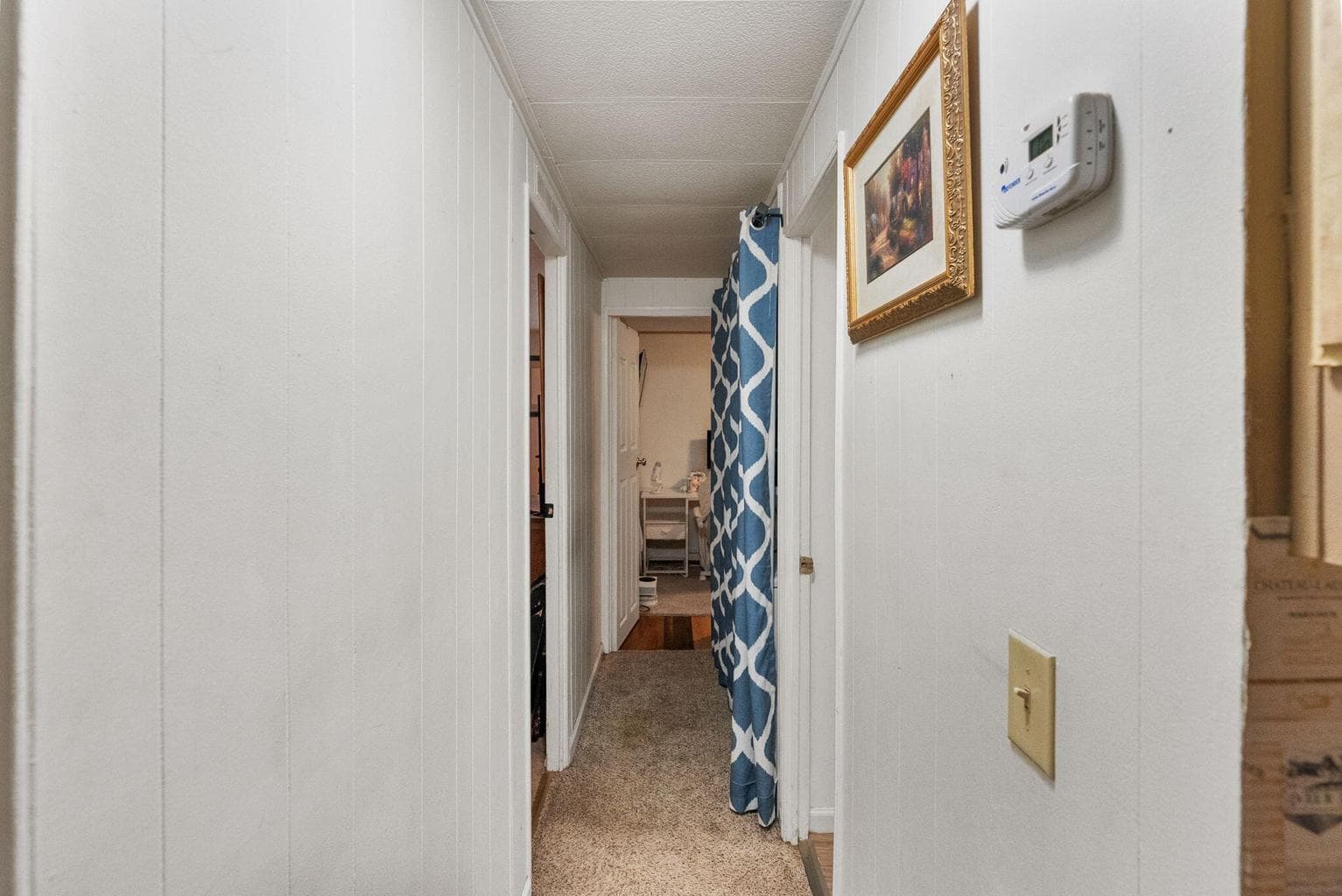 Hallway to laundry, restroom and both rooms