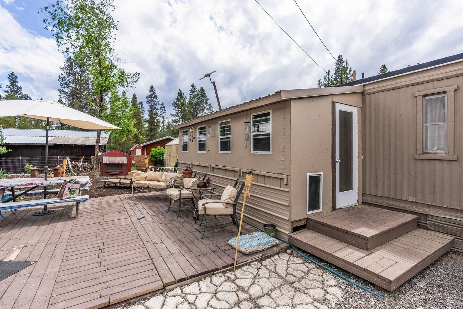 Unattached/enclosed Back porch/Mudroom. Back yard.
