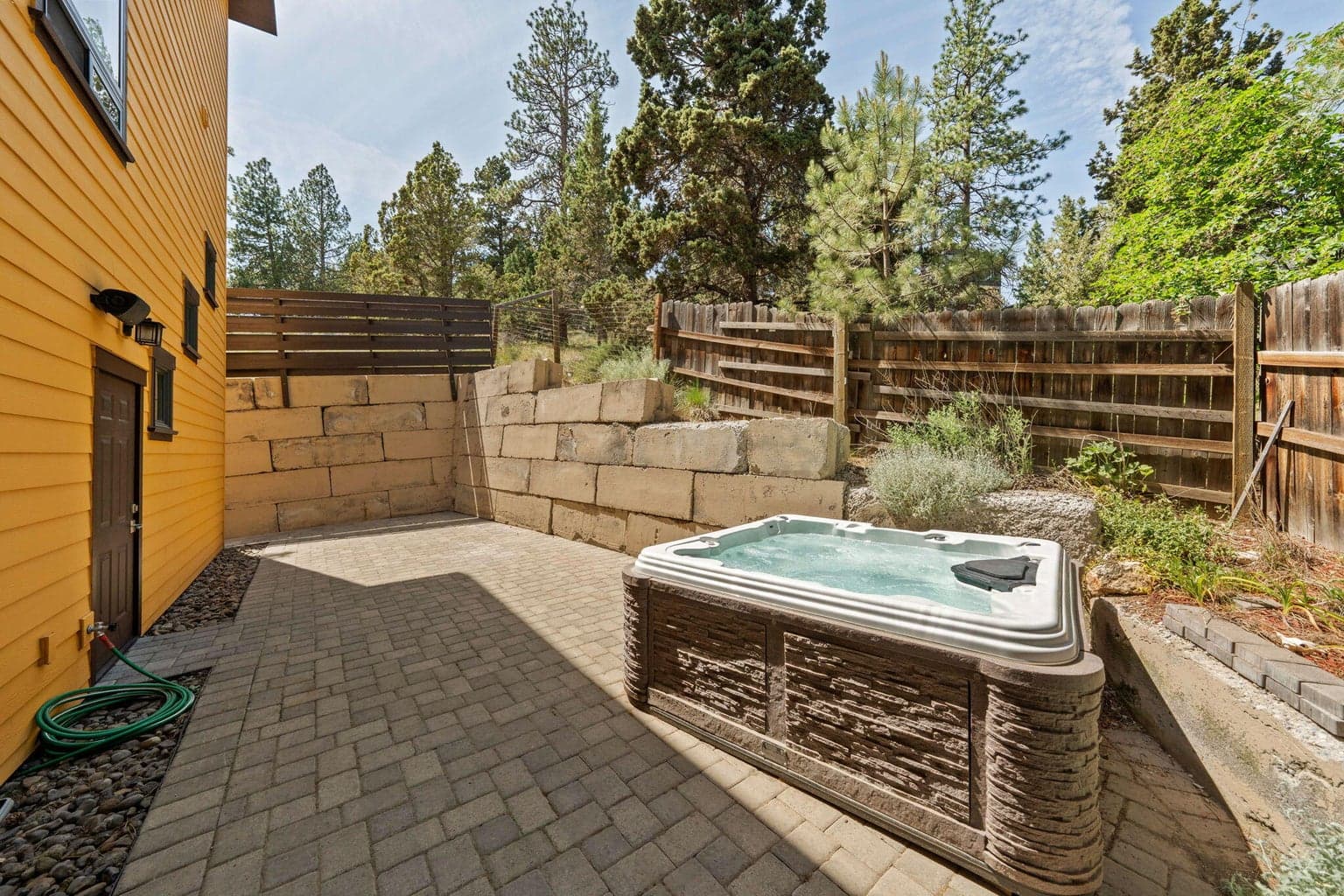 Private, paver patio backyard with hottub