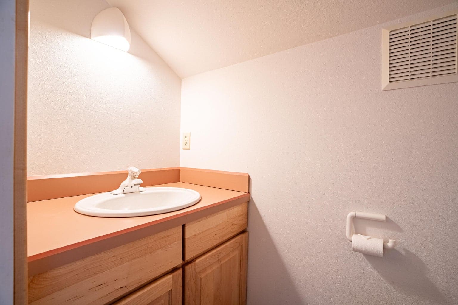 Upstairs 1/2 bath in bedroom.