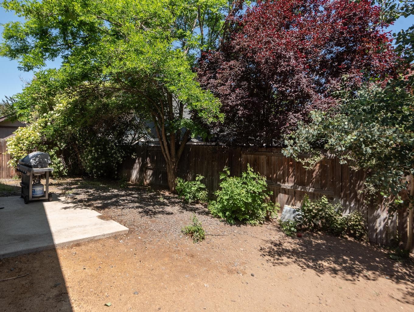 Level and fenced backyard space.