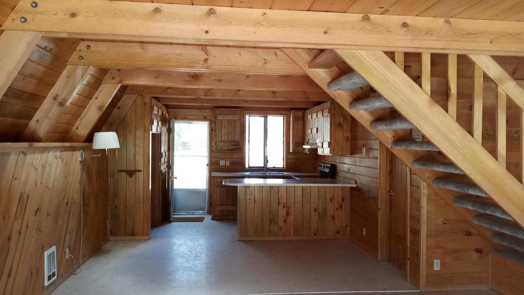 High, open ceilings w/exposed knotty pine