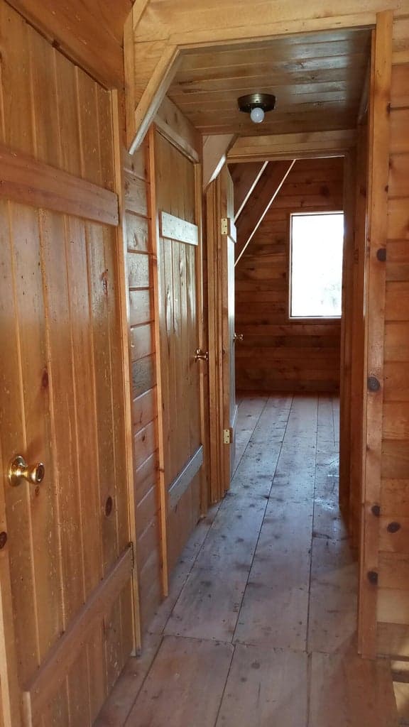 Hallway between upper bedroomsw
