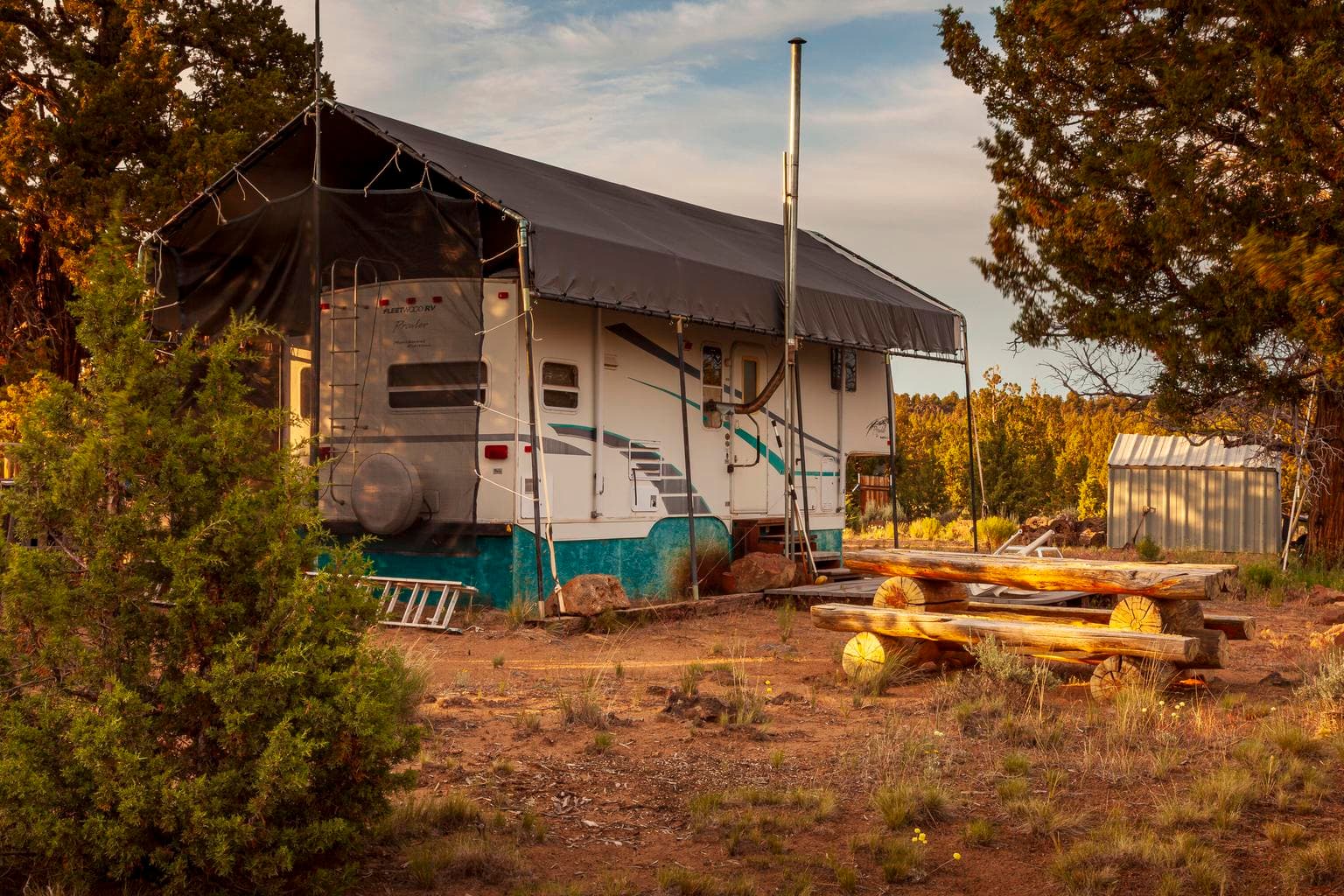 5th wheel, canopy, and Juniper log picnic table are included in sale.