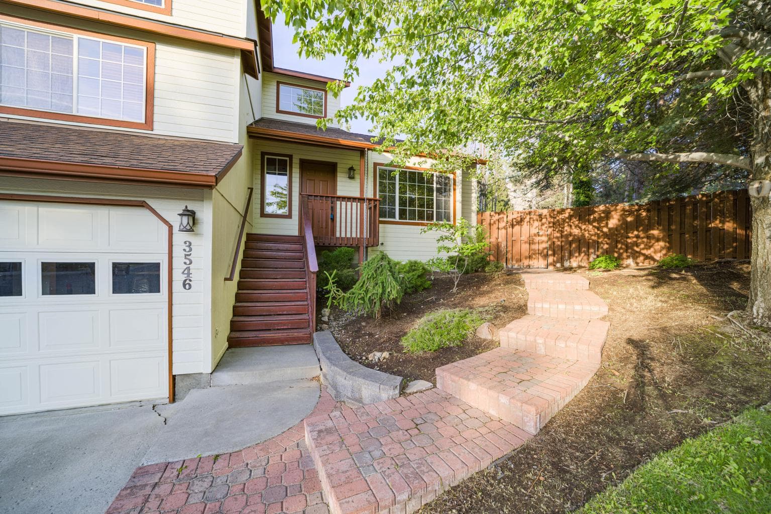 Front entry & brick walkway to south side back yard