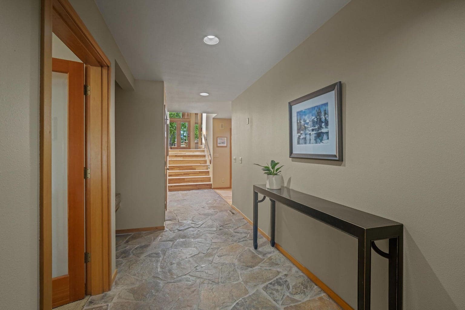 Entrance into 6 Shadow opens on to slate hallway.