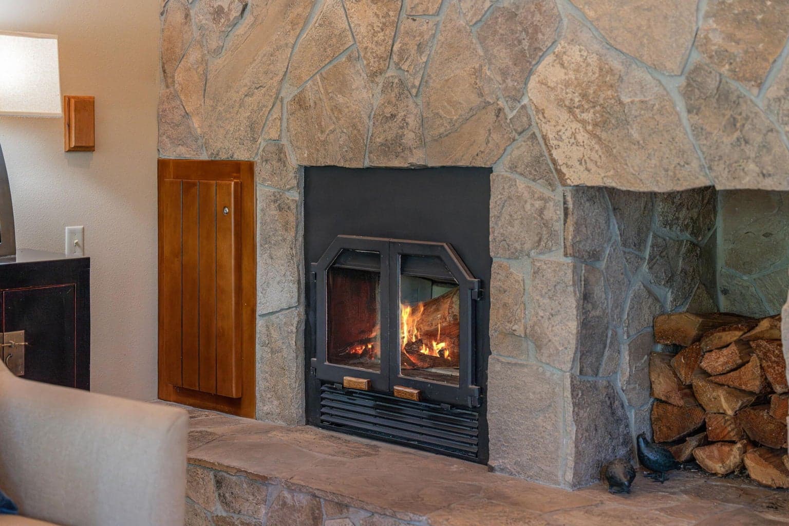 Wood Elevator - Enjoy a wood burning, cackling fireplace for the colder nights in Central Oregon. Built in wood alcove and wood elevator featured to the left for dry/cured wood to be hauled up from the basement.
