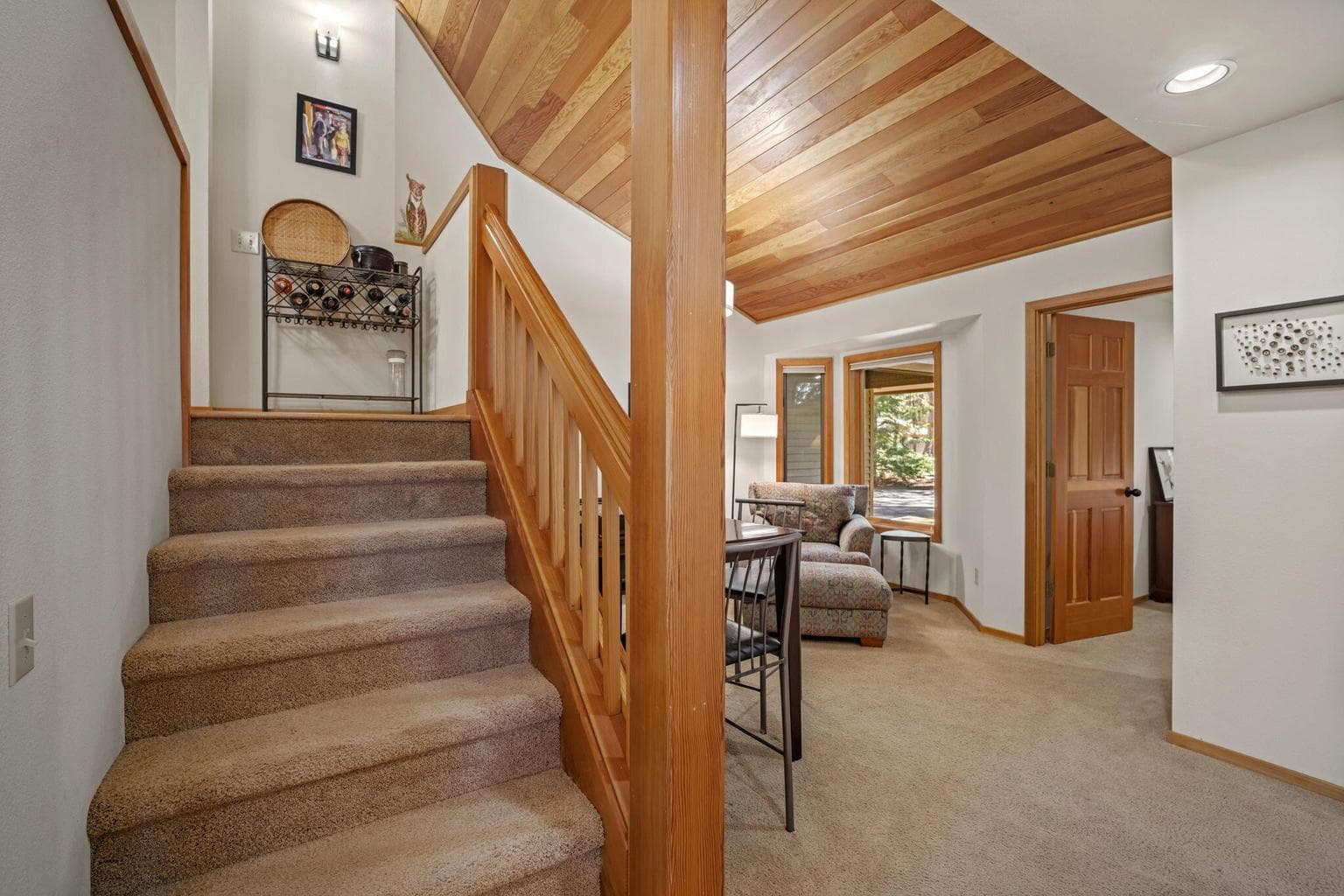 Stairs to upper level, enter into the kitchen by the banquette.