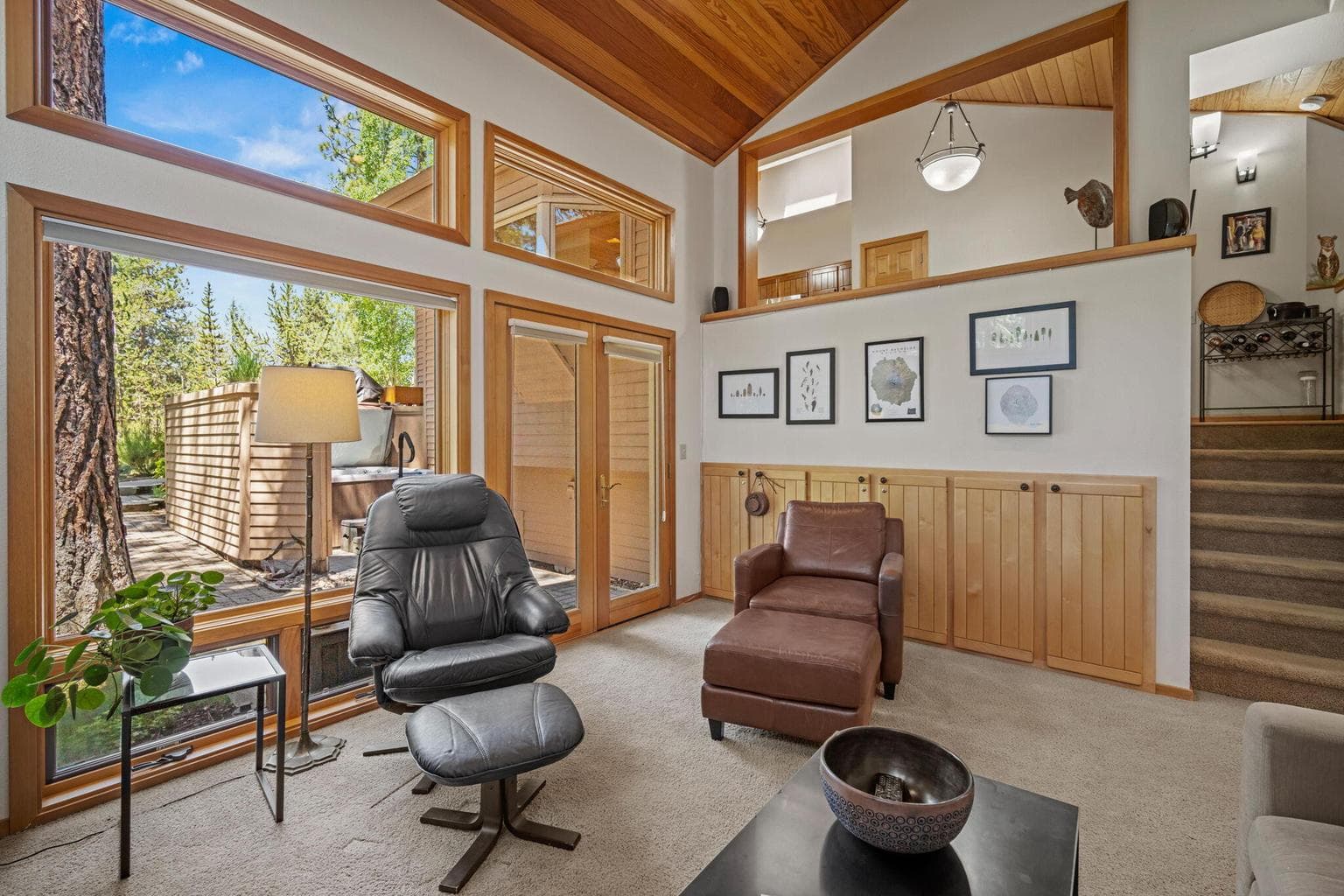 Enjoy the comforts of this amazing main level family room with an entire wall of windows to the outdoors. Enjoy access to the patio and hot tub.