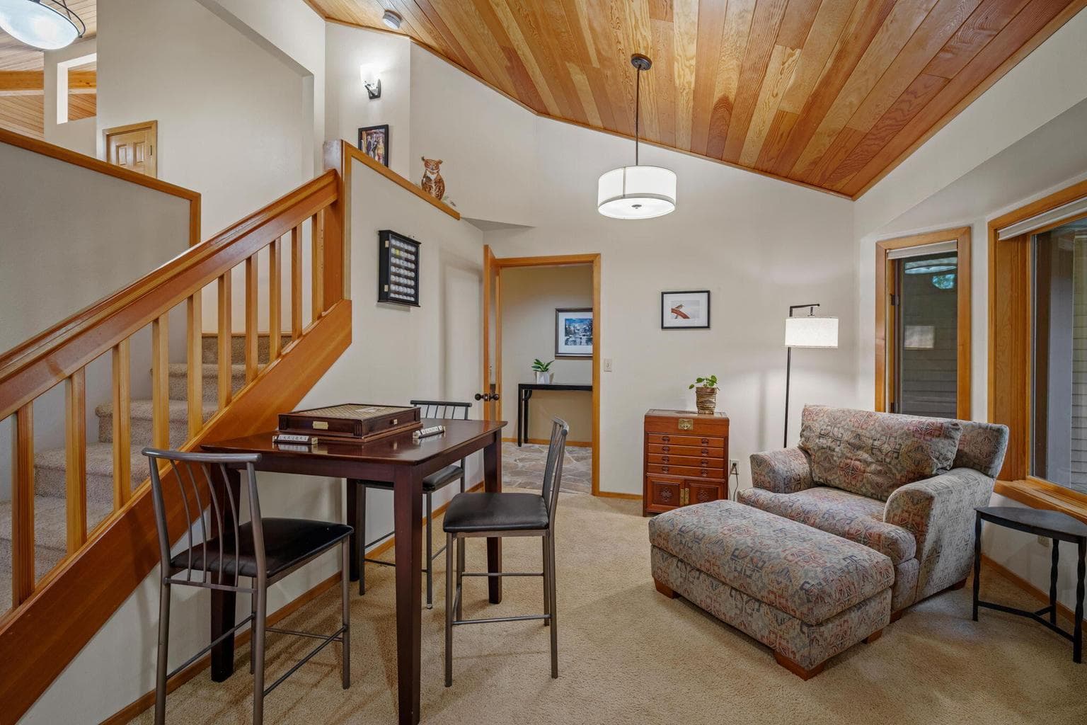 "Reading nook" or "game cove," part of the main level family room that feeds into the lower level bonus room or entertainment room.
