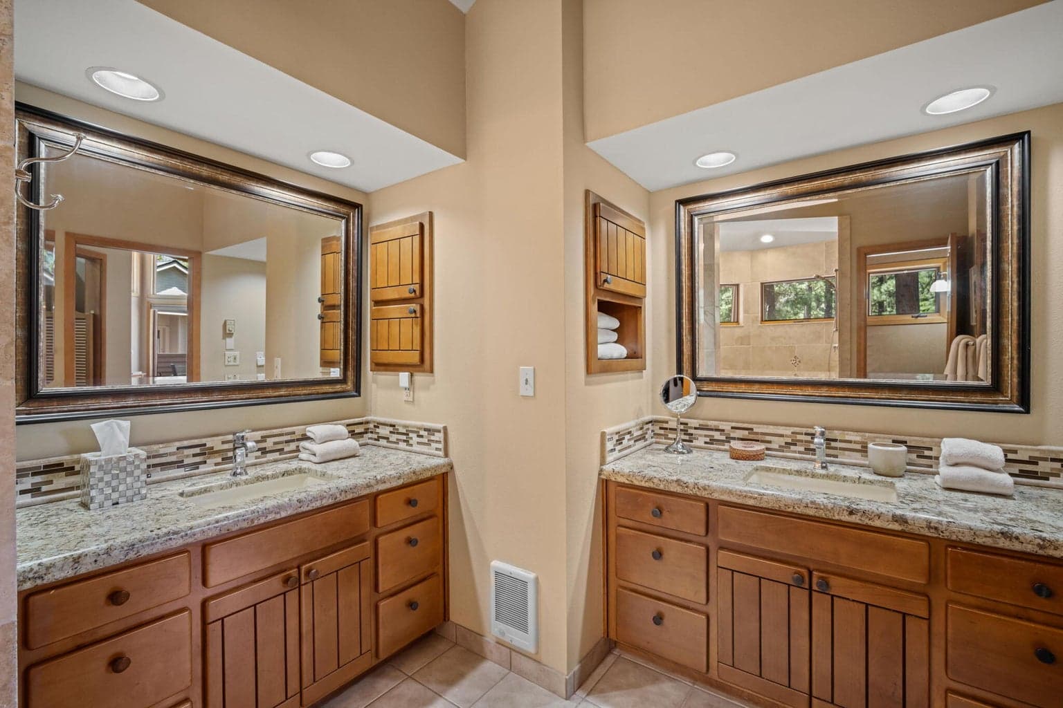 Dual vanities in this spa like primary bathroom.