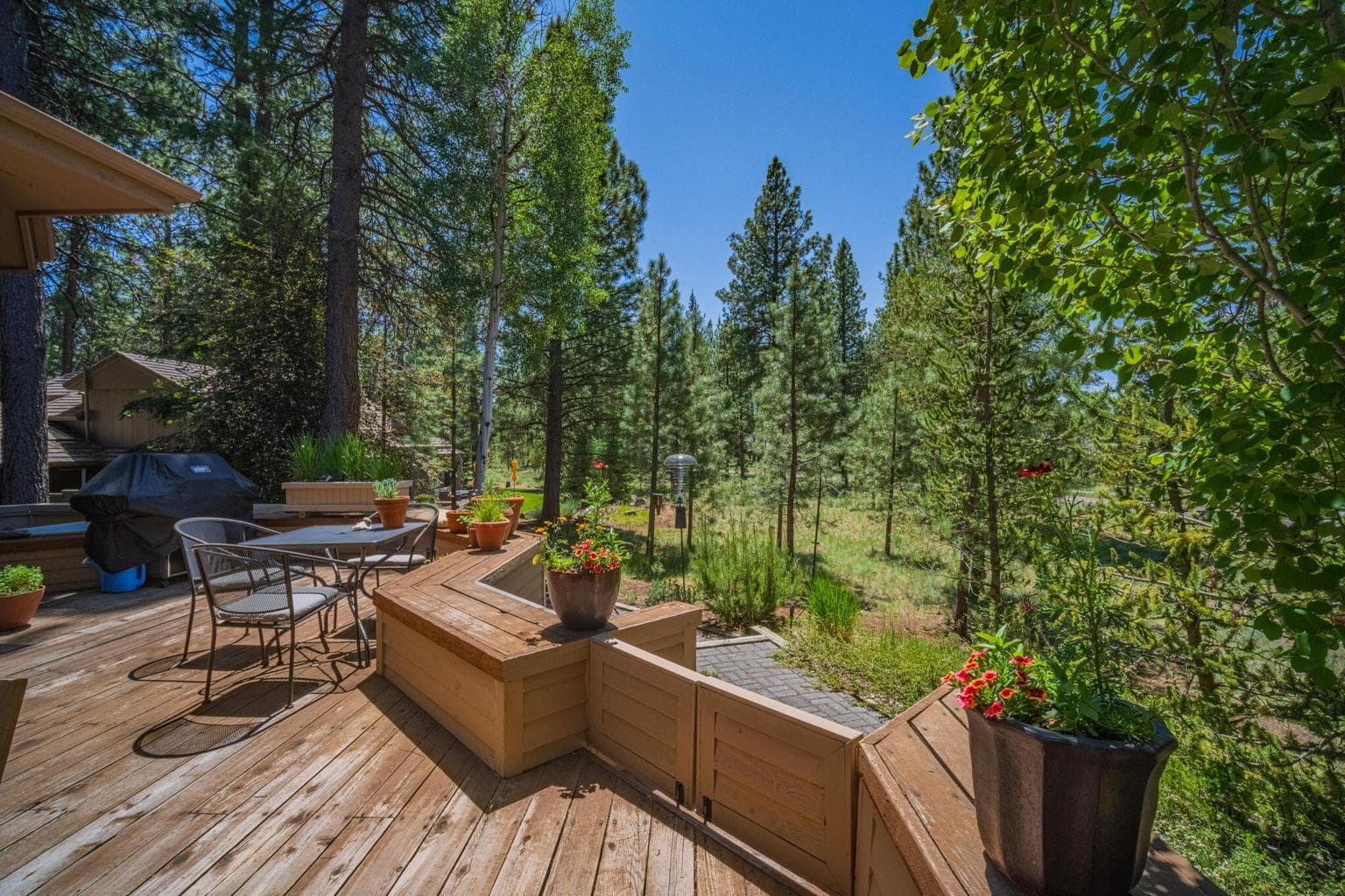 Back deck with gate to the lower level paver walkway.