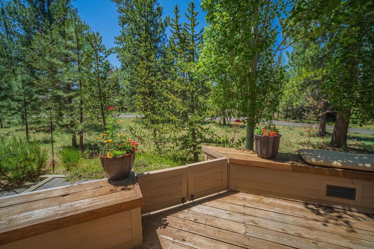 Gate featured here to walk down to a paver walkway to hot tub and back patio area - gate closed.