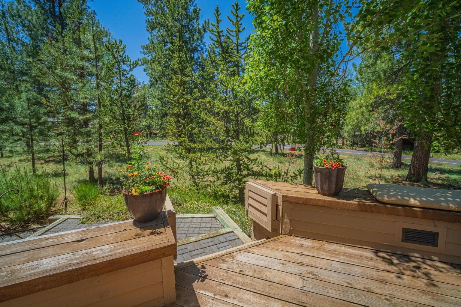 Gate featured here to walk down to a paver walkway to hot tub and back patio area - gate open.