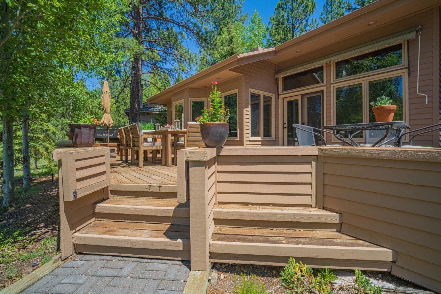 Gate featured here to walk from a paver walkway up to the back deck.
