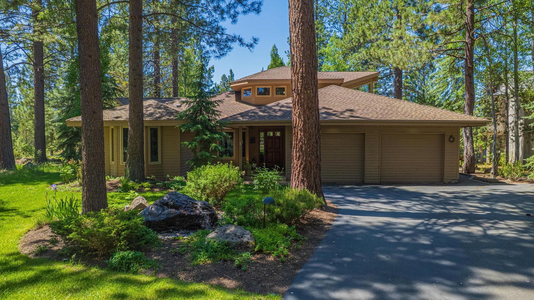 Enter 6 Shadow Lane, with a long paved and private driveway.