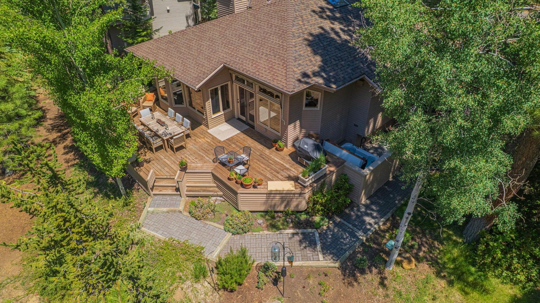 Aerial view of the SW corner of the exterior grounds and back deck.
