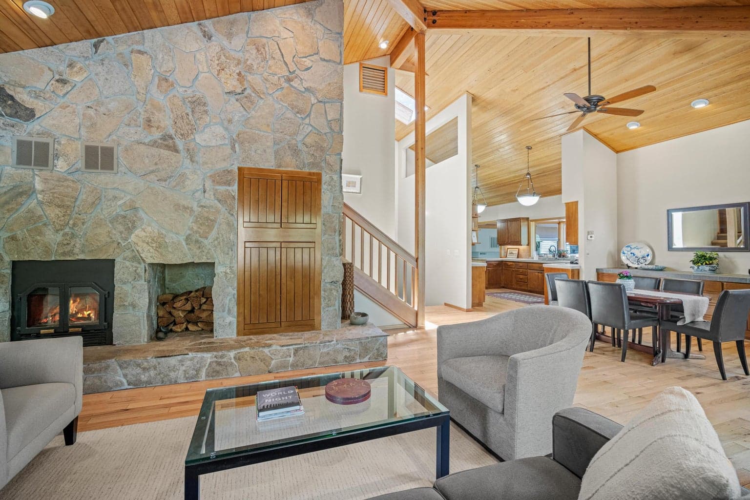 Living room area, view towards the kitchen and dining area.