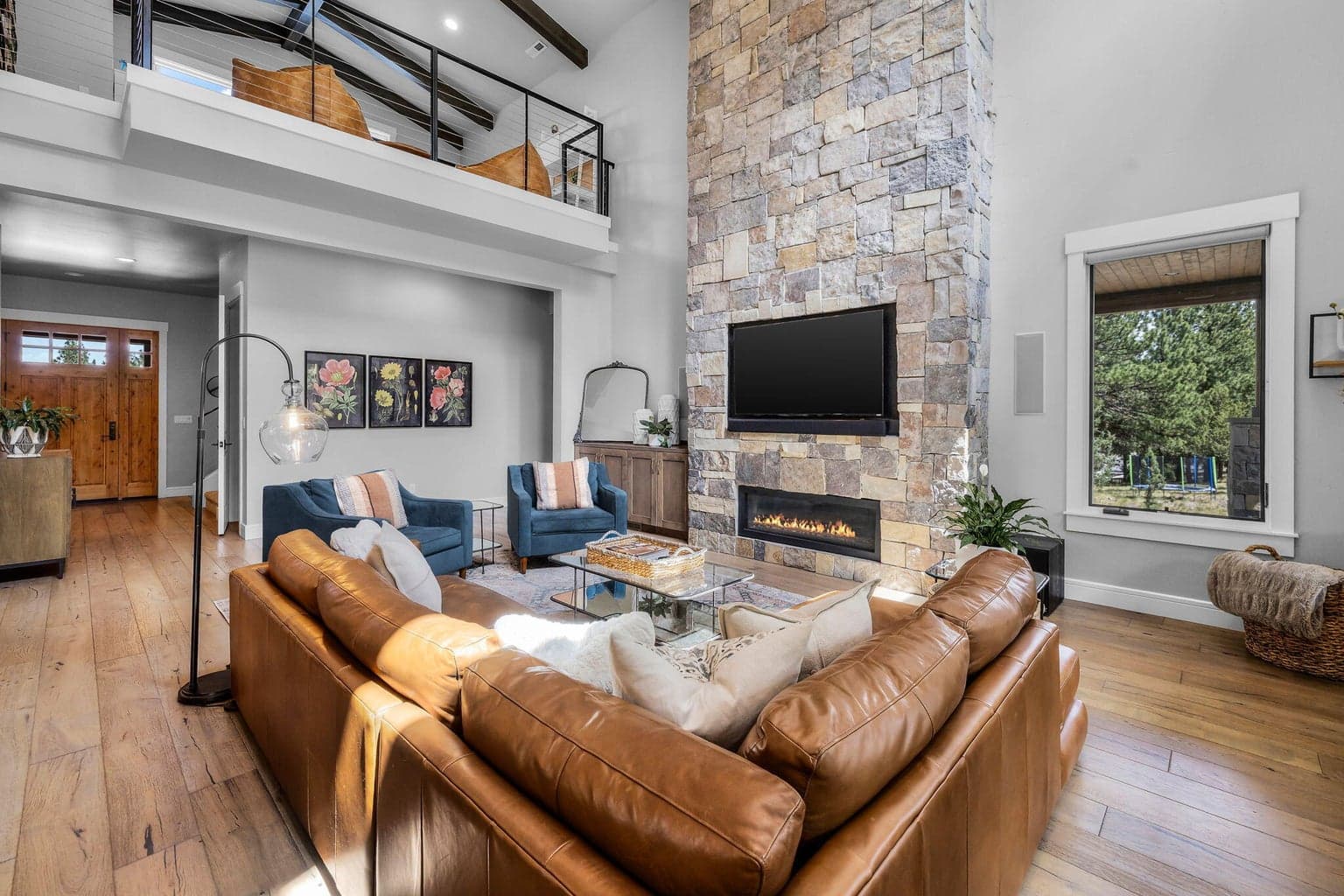 Beautiful hardwood flooring throughout the Great Room and dramatic stone gas fireplace.