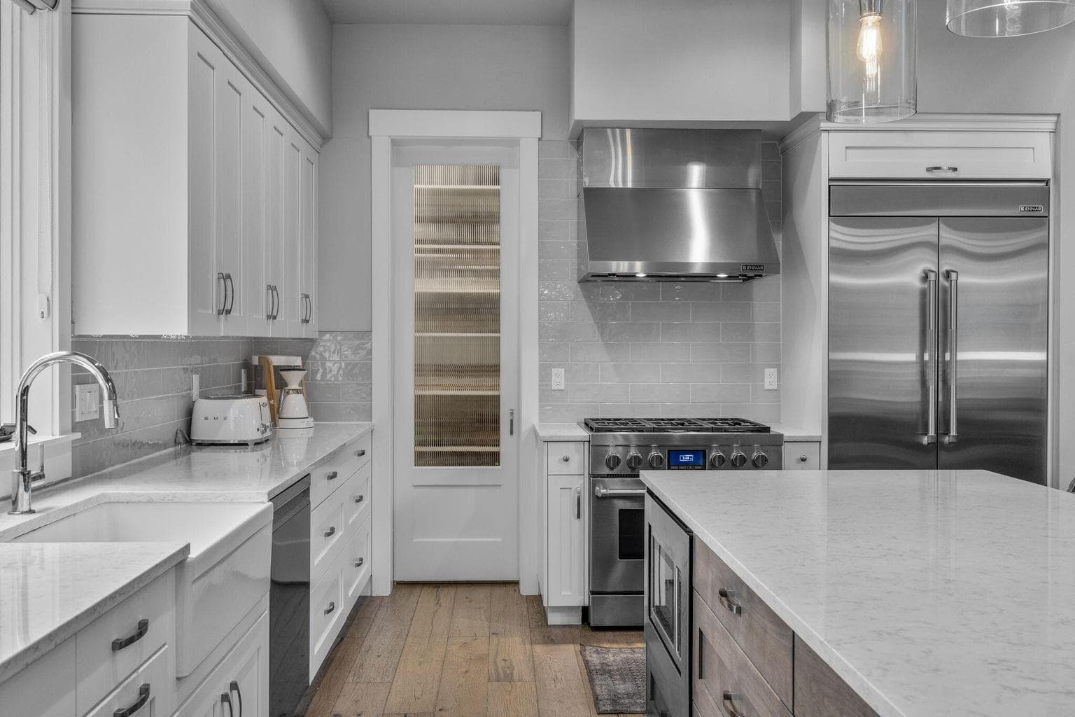 Farmhouse sink and ample cabinetry.