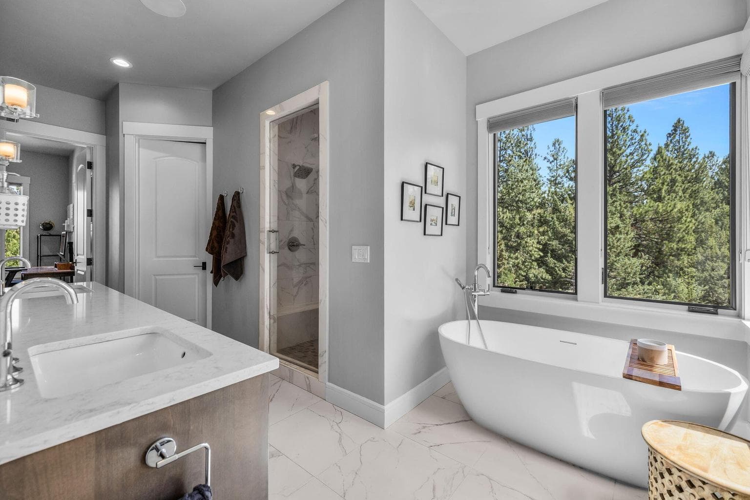 Luxurious and spacious with dual vanity, relaxing soaking tub and dual head steam shower.