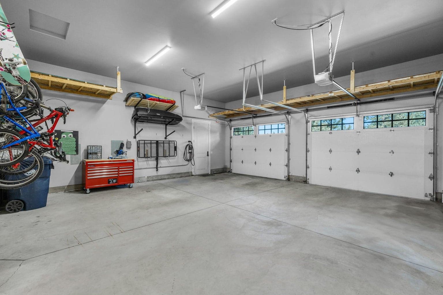 Oversized 3 car with high ceilings and built-in shelving for all your gear.