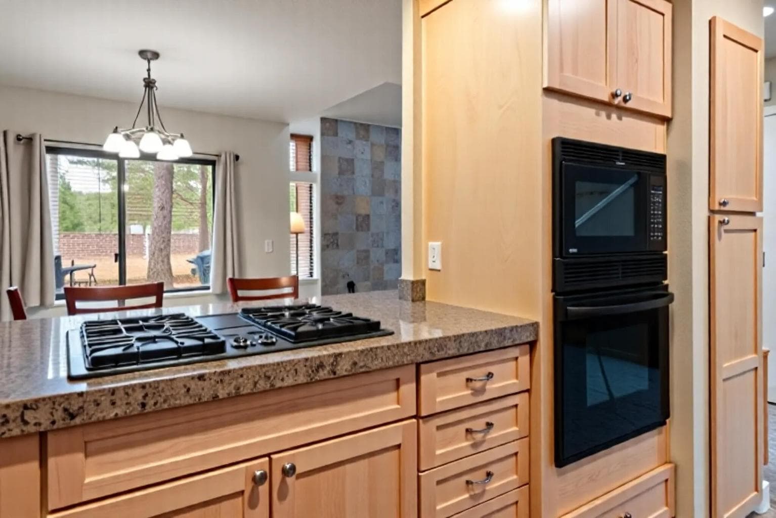 Kitchen with View to Outside and Dining Area