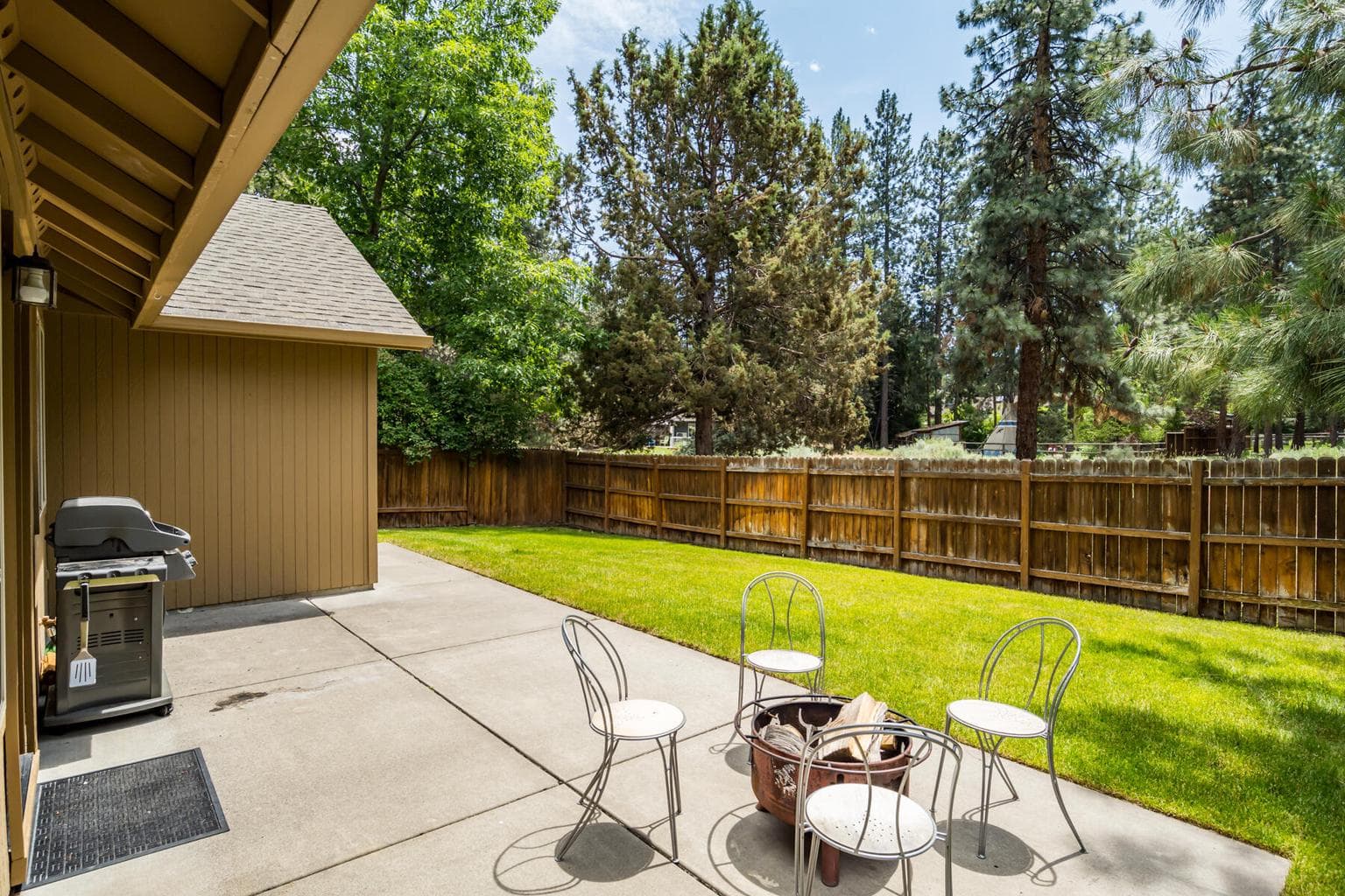 Private yard surrounded by mature trees