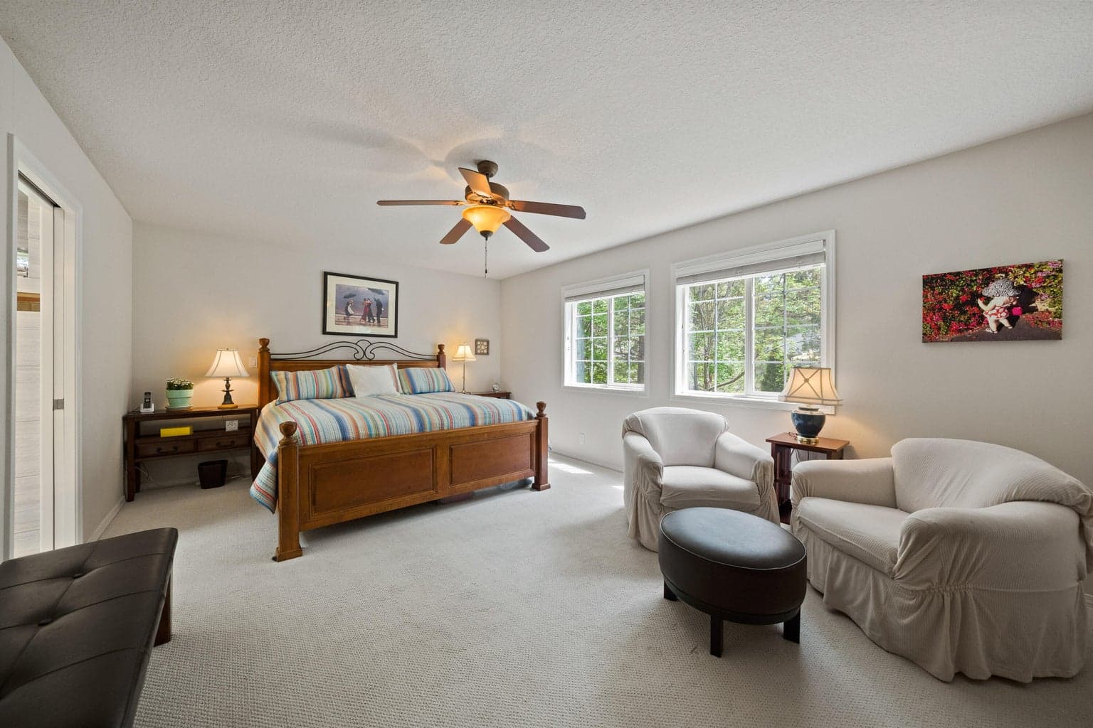 The expansive primary suite has its own access to the deck and has room fora sitting area or workout space.