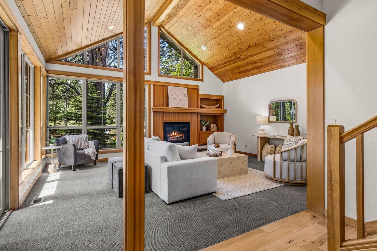 Great room with wood vaulted ceilings- tons of natural light!