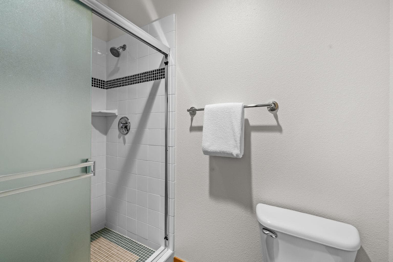 Upper level primary bath- walk-in tile shower.