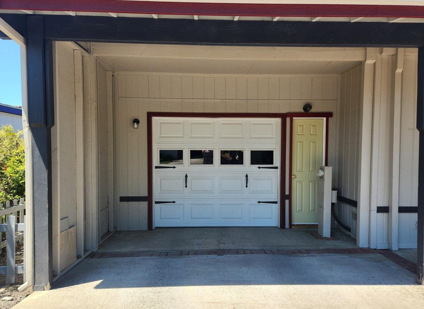 One car insulated garage with storage area.