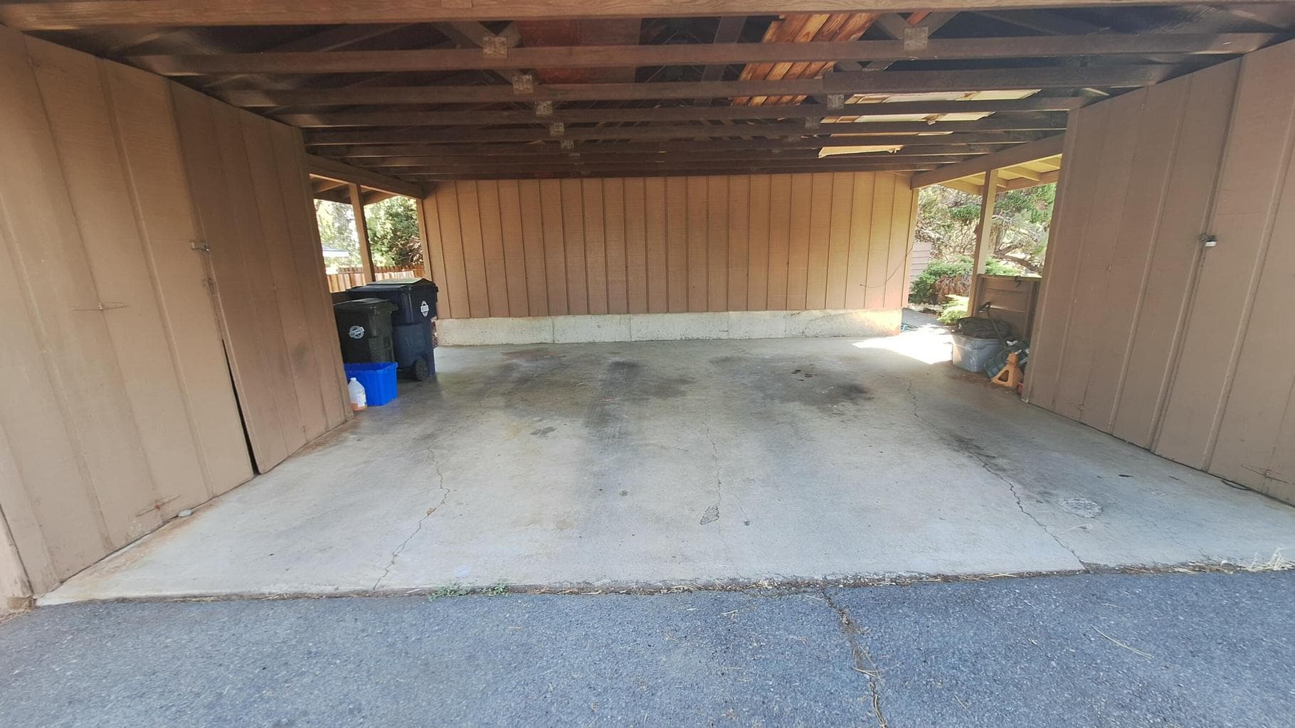 Covered parking for 1 car for each unit, plus separate storage on the sides of the carport.