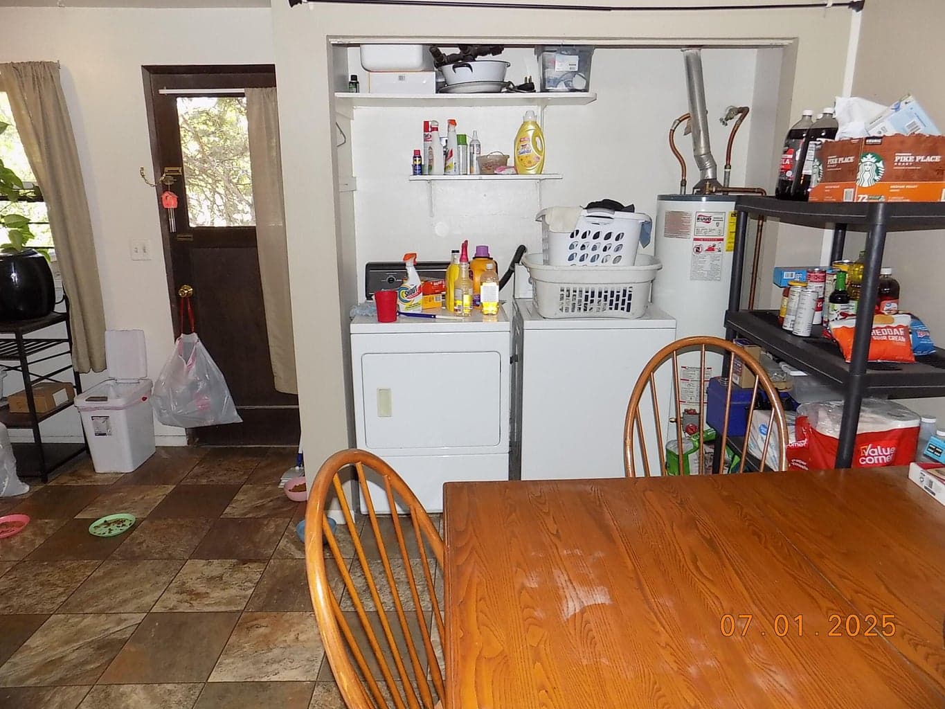 View from living room towards dining area and laundry closet.