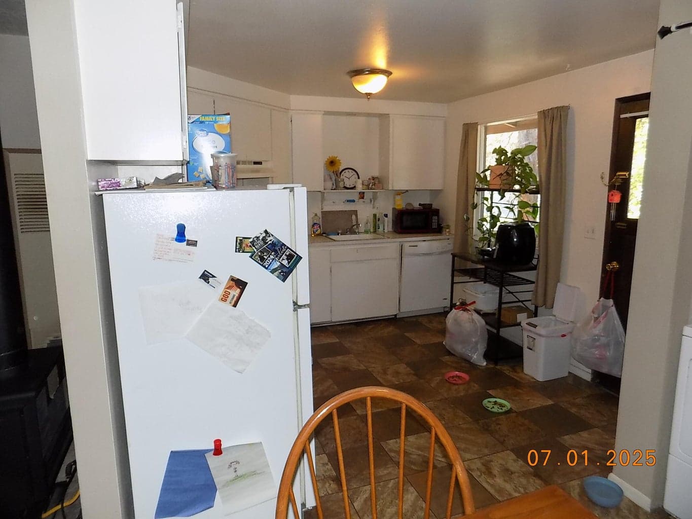 View from dining area towards kitchen. Back door access to rear deck.