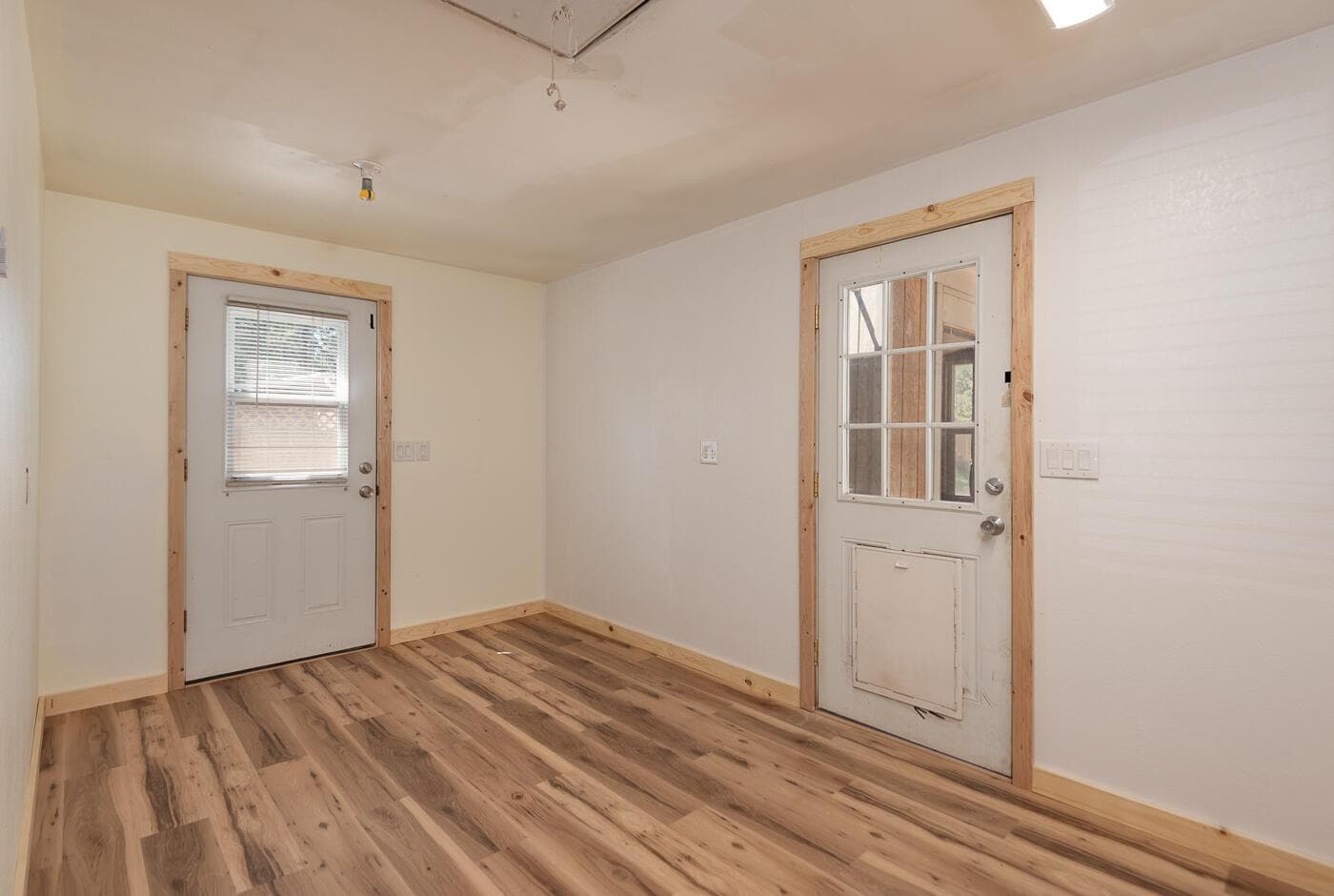 Laundry room with access to side yard and back yard