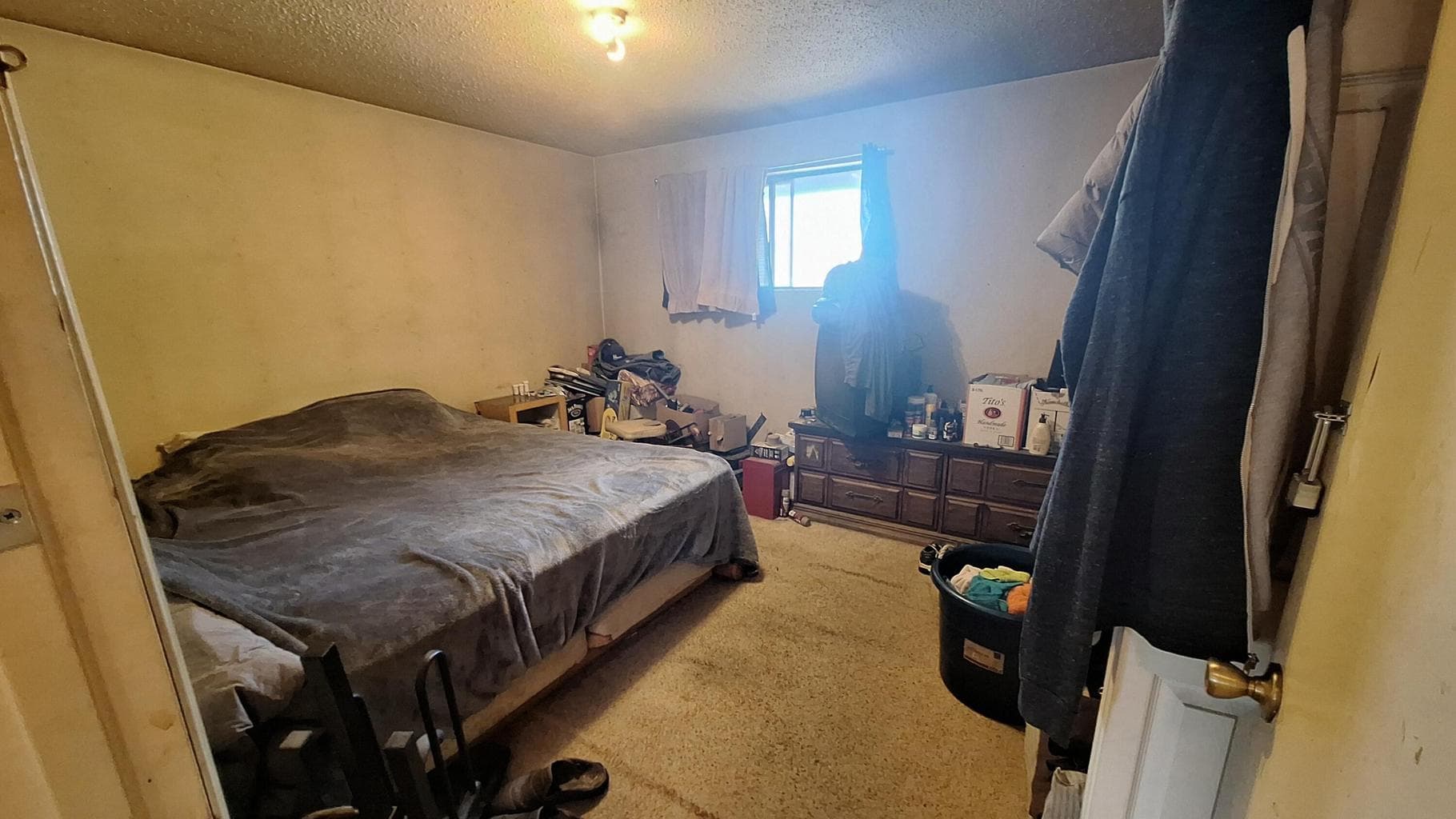 One of the bedrooms of the non updated unit