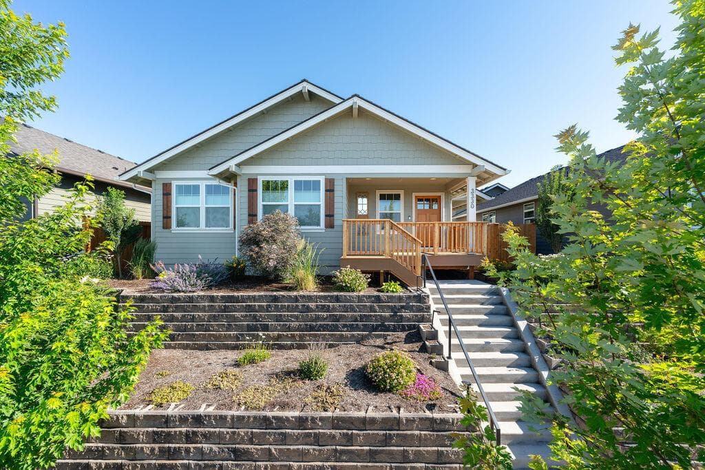Beautiful home with terrace landscaping at front entry