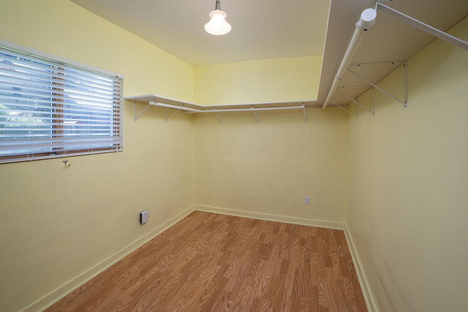 Front bedroom has a lot of extra shelving which can be kept or removed.