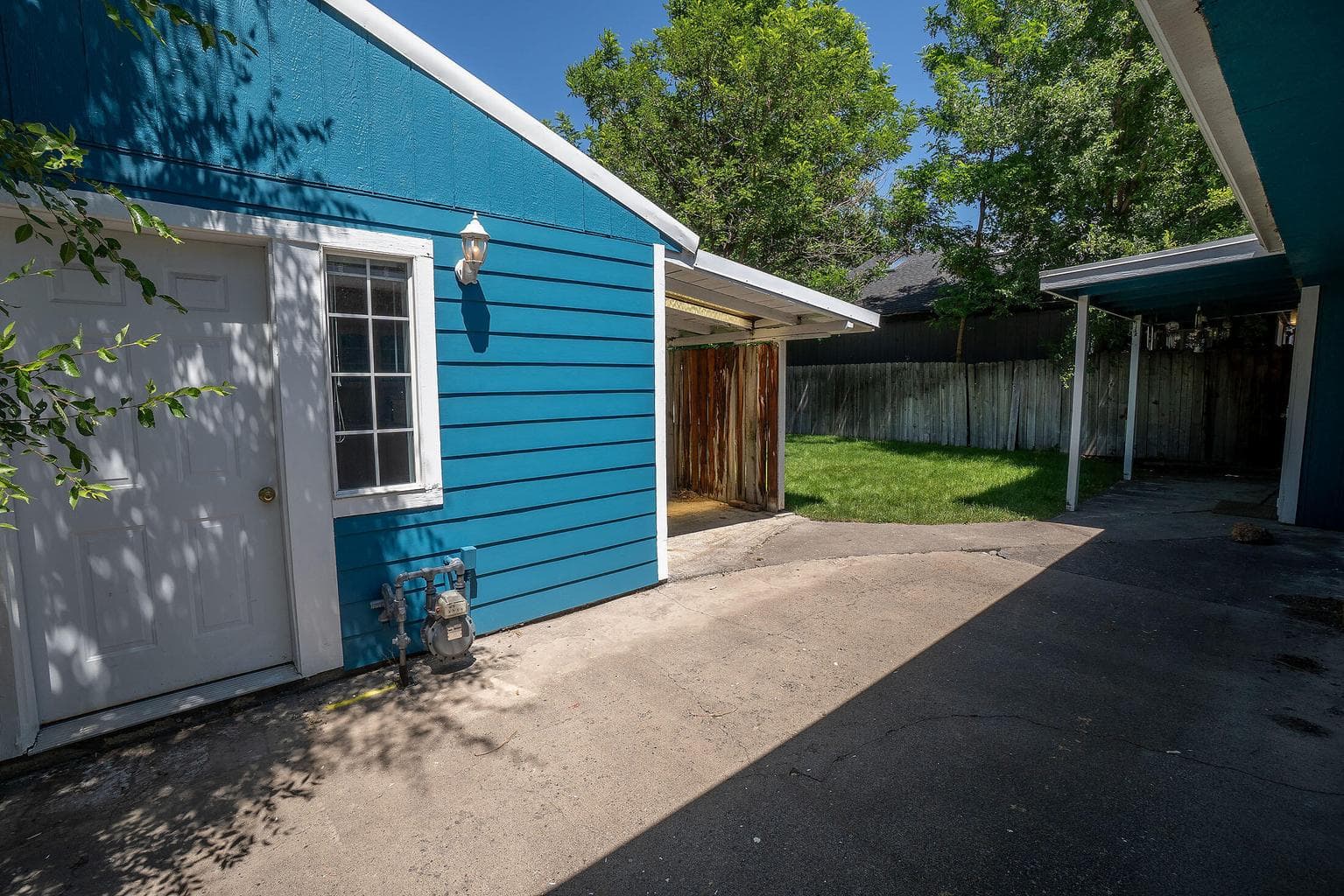 Front door to studio cottage, and open patio courtyard area.