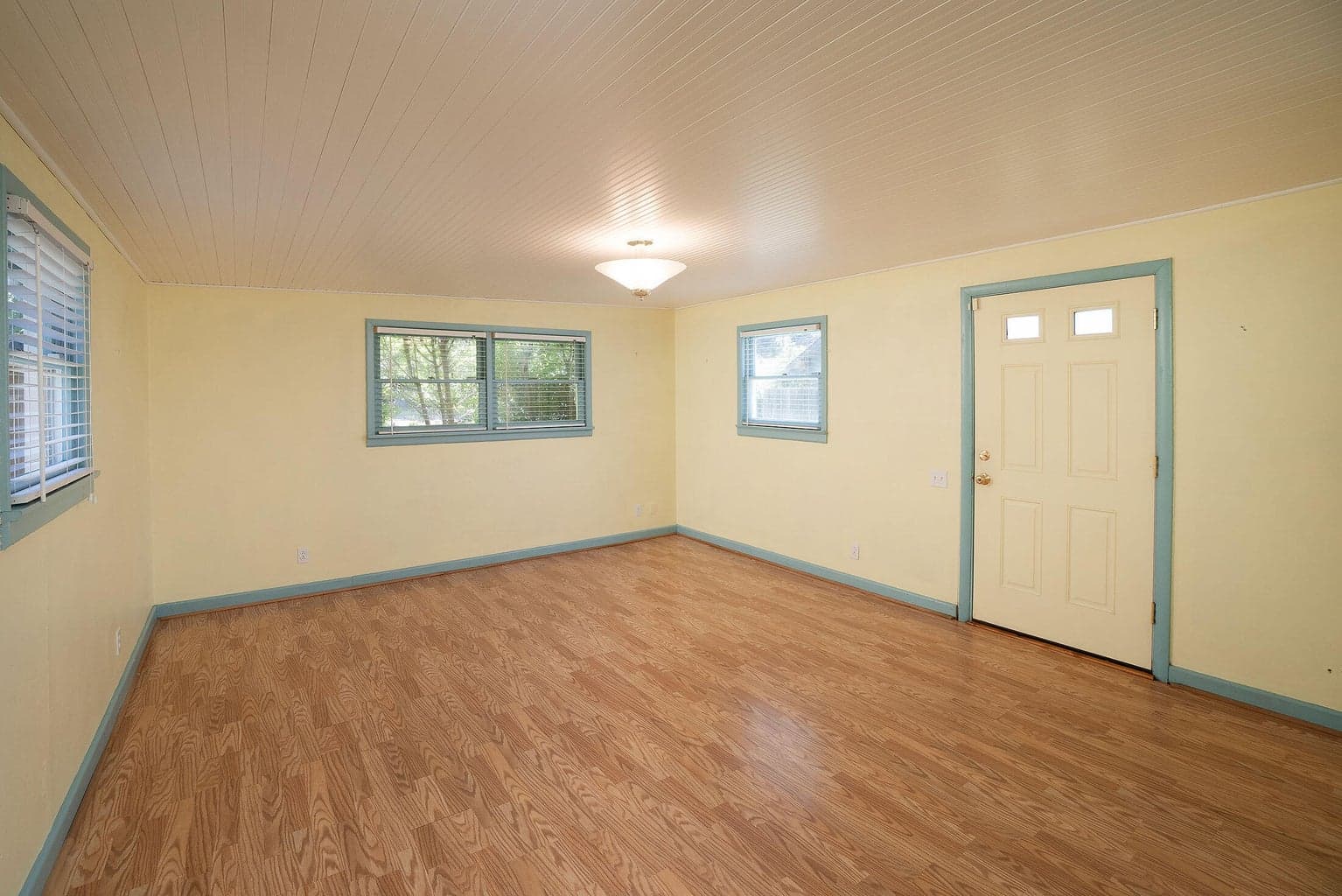 Open living area in the main home with windows all around for natural light.