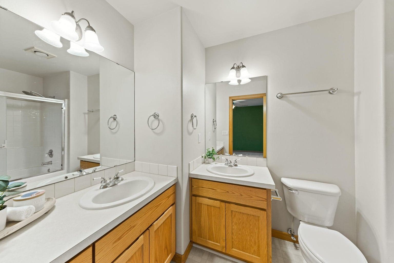 Primary bathroom with 2 sinks and tub/shower combo
