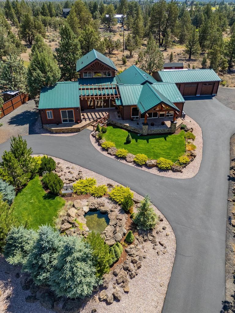 Tranquil water feature, 3 Car Garage, Metal Roof, Privacy, Paved Drive, Cedar Siding