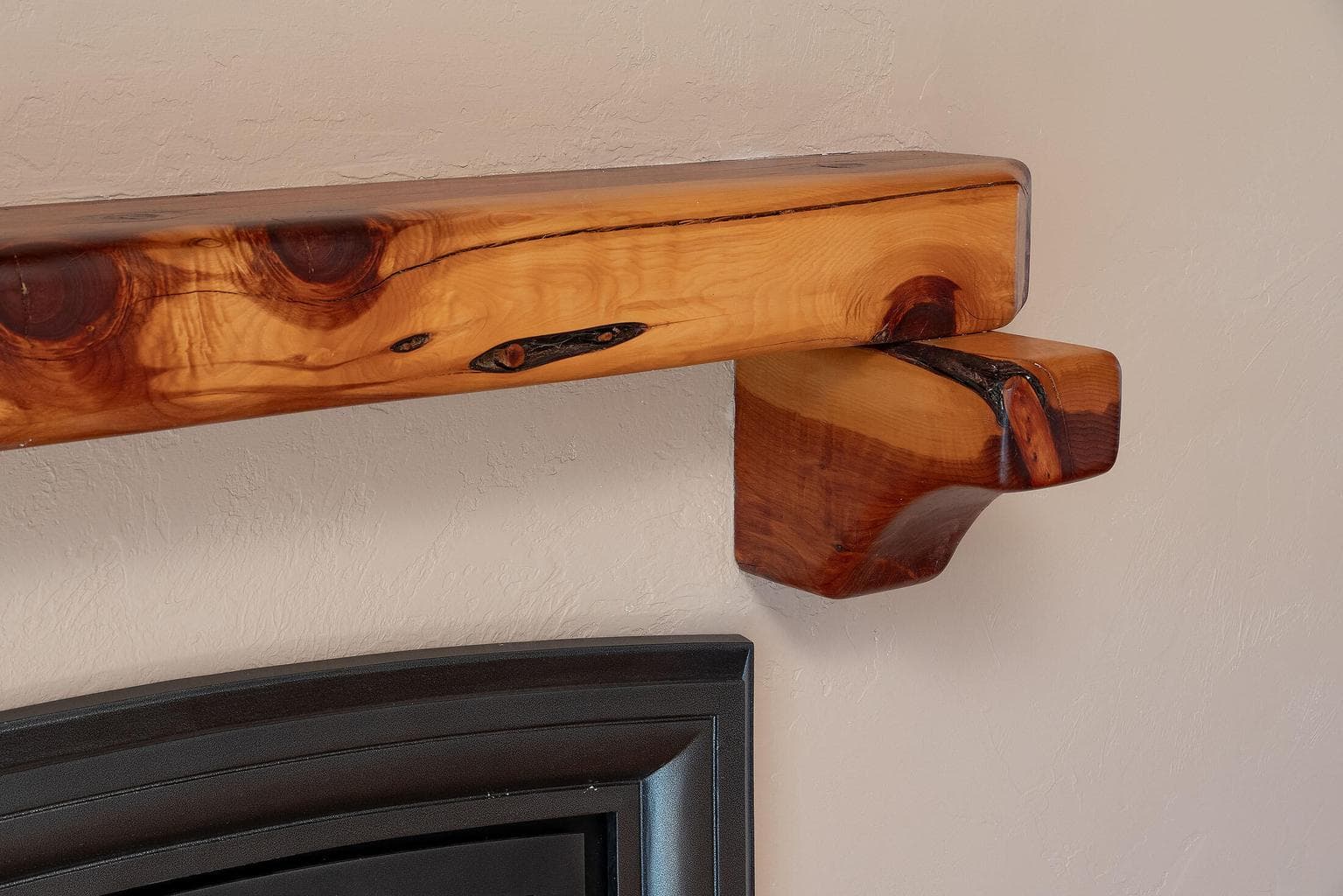Juniper mantel in the sunroom