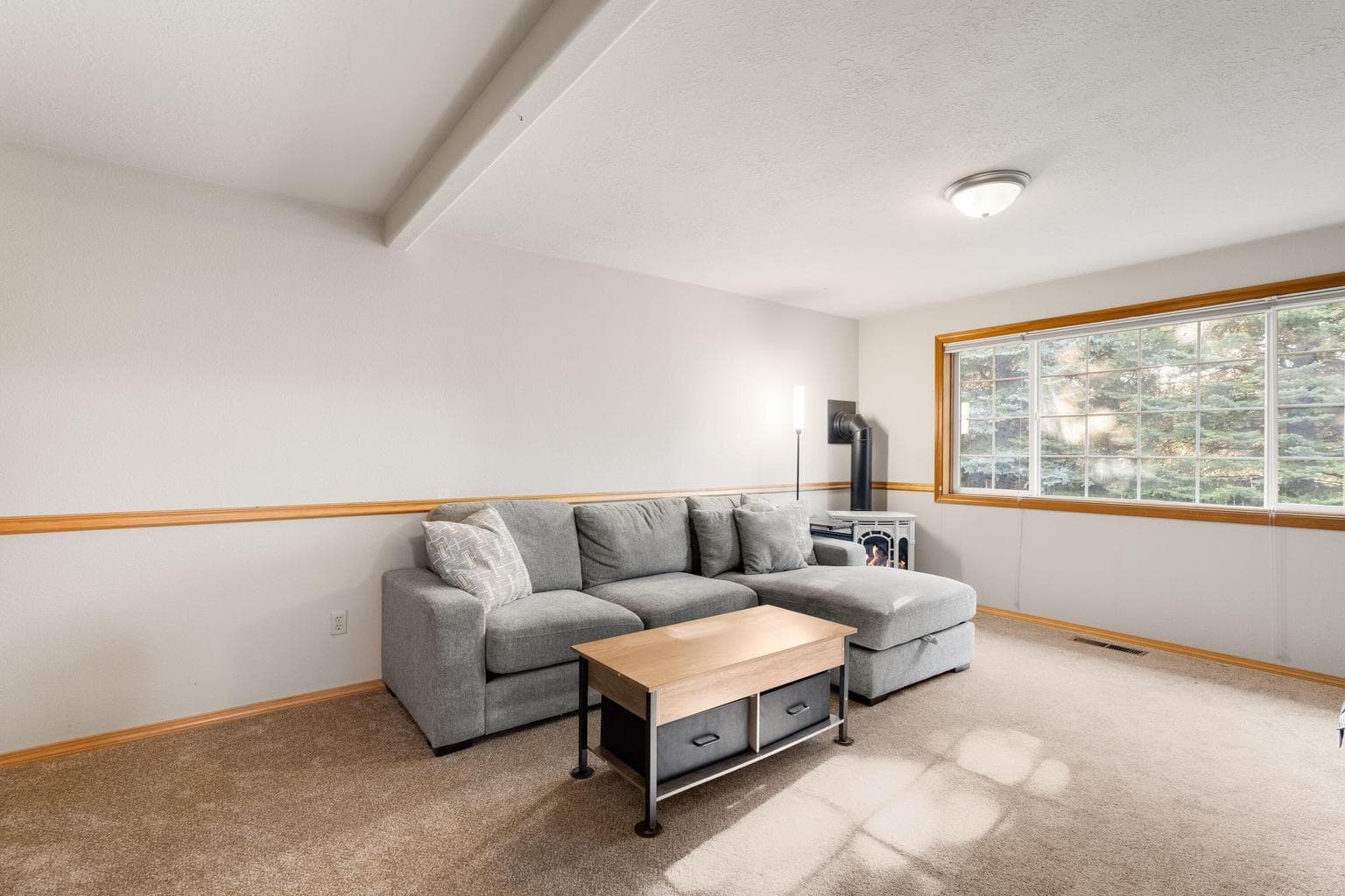 Downstairs bonus/family room with gas fireplace.