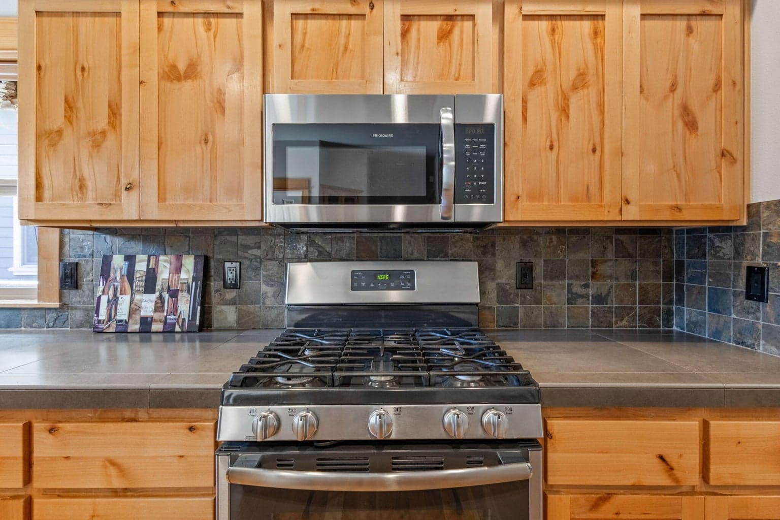 Stainless appliances with black details.
