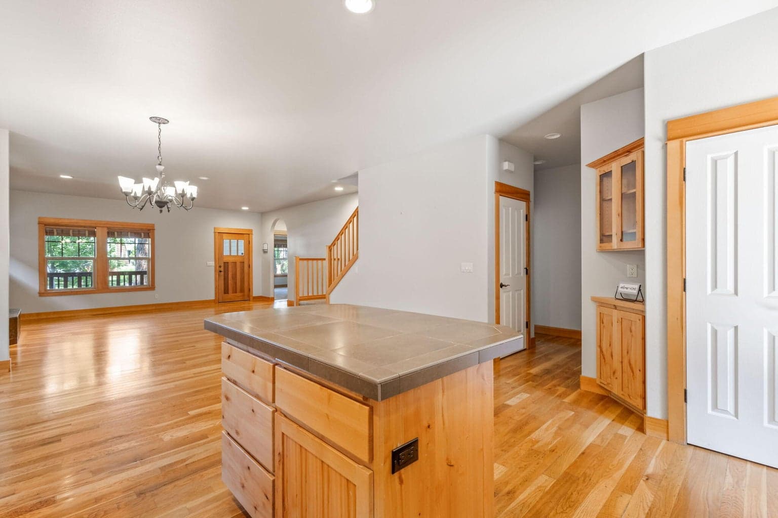 Pantry located next to the hallway accessing two more main level bedrooms.