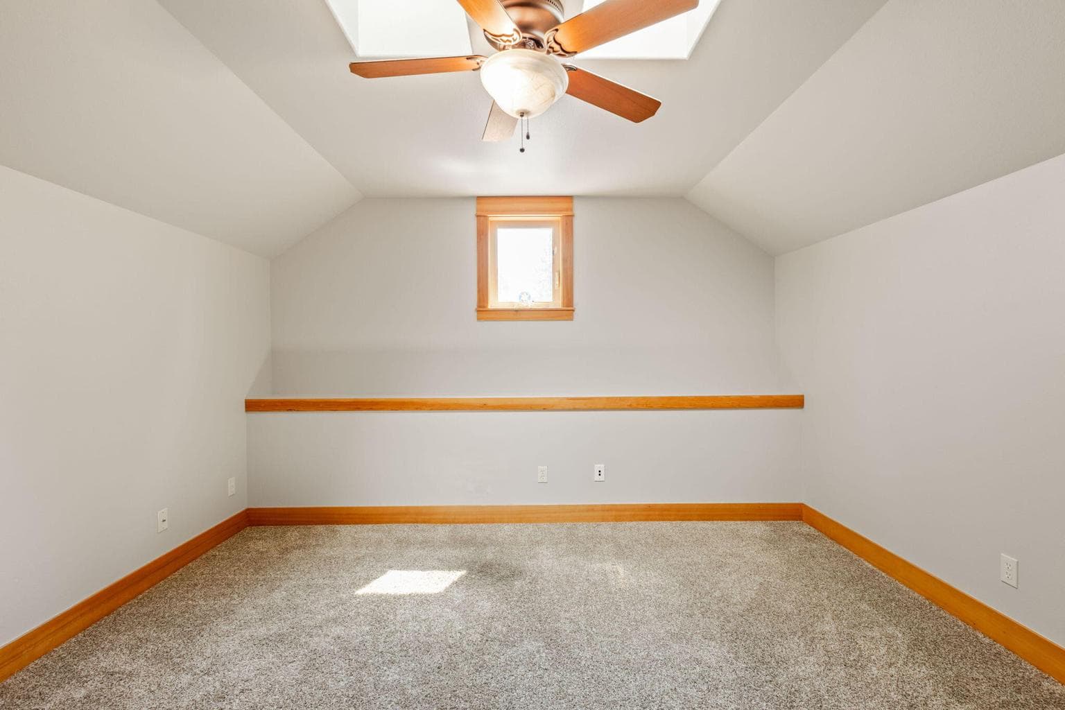 Upstairs office with ceiling fan.