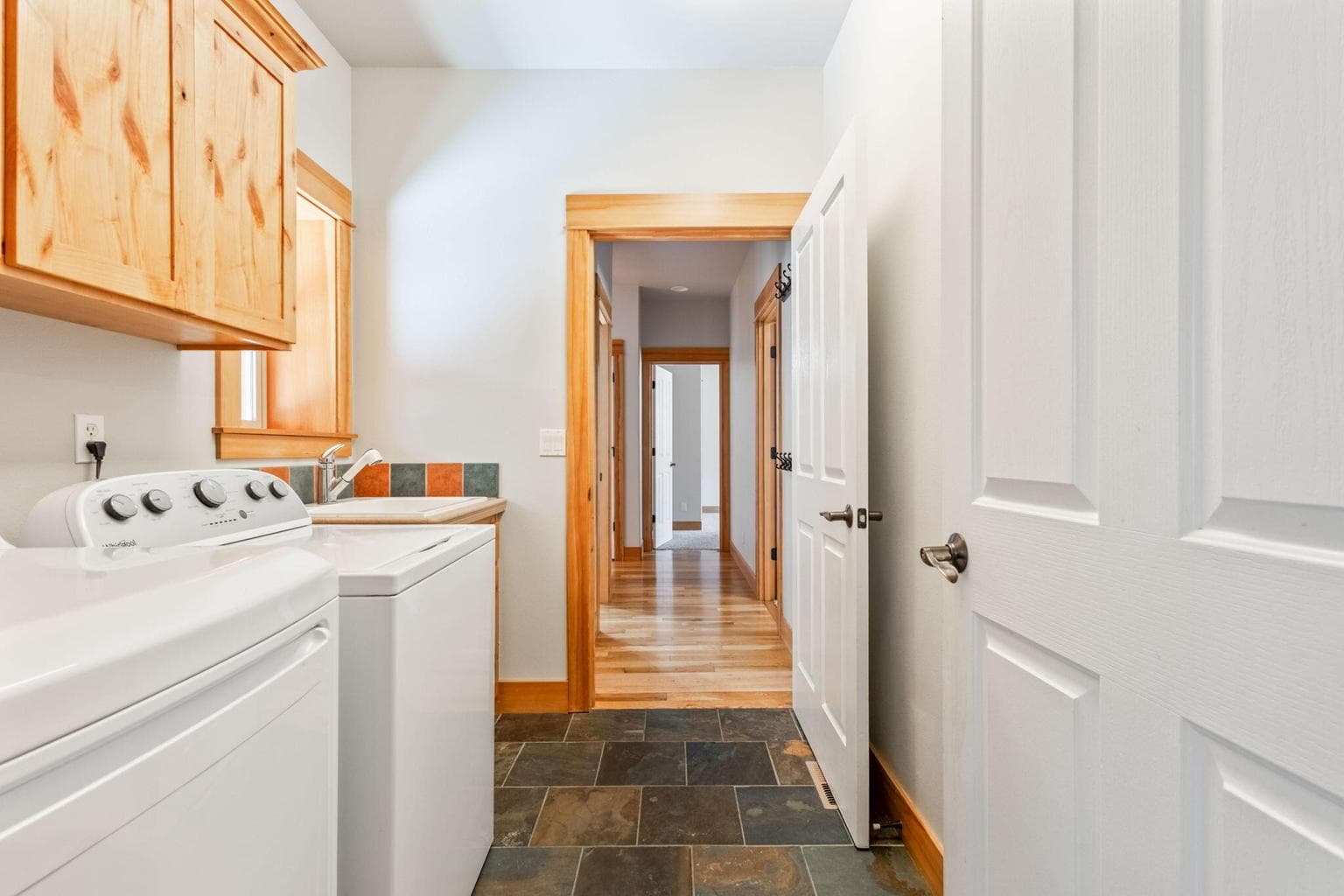 Laundry room is on the main level, where 3 of the bedrooms are.