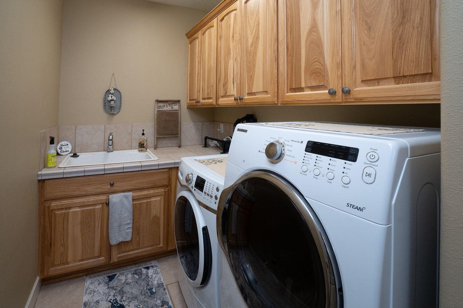 Laundry room conveniently adjacent to the kitchen and off the garage.